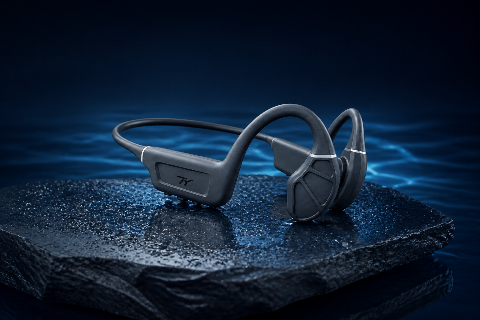 TY open-ear headphones with swim training gear on a pool deck