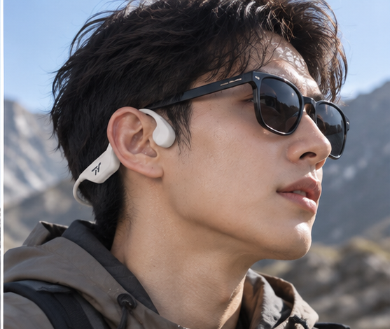 Hiker wearing beige TY Bone Conduction Style 4 with sunglasses